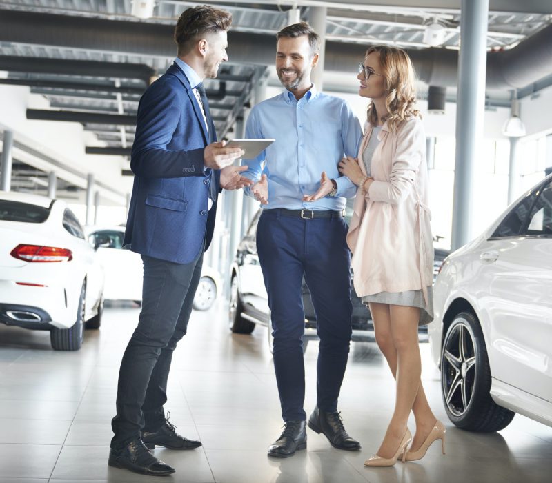 Couple purchasing brand new car